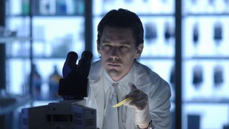 Edward Dalton examines his microscope in "Daybreak" (2009)