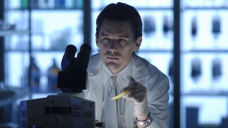 Edward Dalton examines his microscope in "Daybreakers" (2009)
