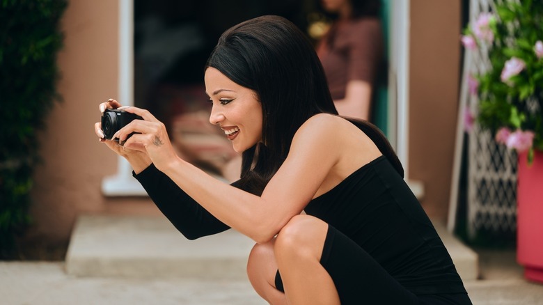 Maddy snapping a photo on Euphoria