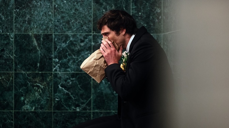 Nate breathing into a paper bag in a bathroom on Euphoria