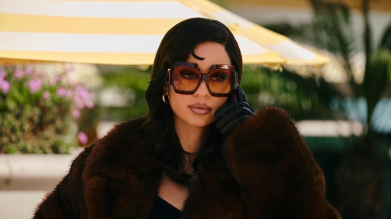 Maddy on the phone wearing sunglasses and a fur coat on Euphoria