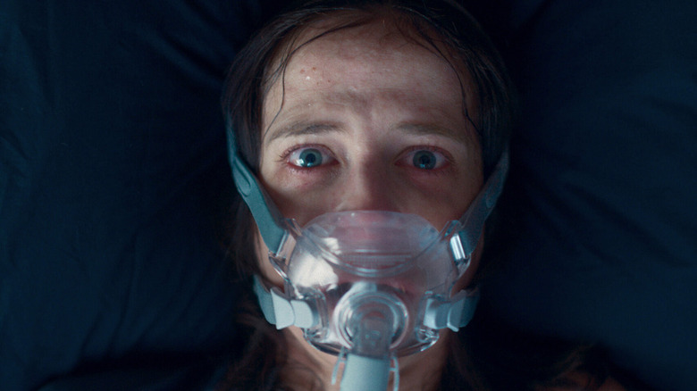 Christine in oxygen mask in Nocebo
