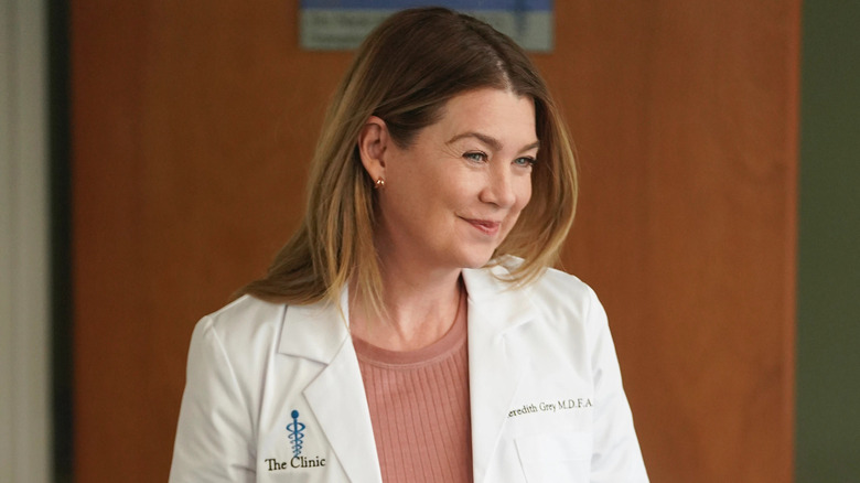 Meredith tan sweater smiling