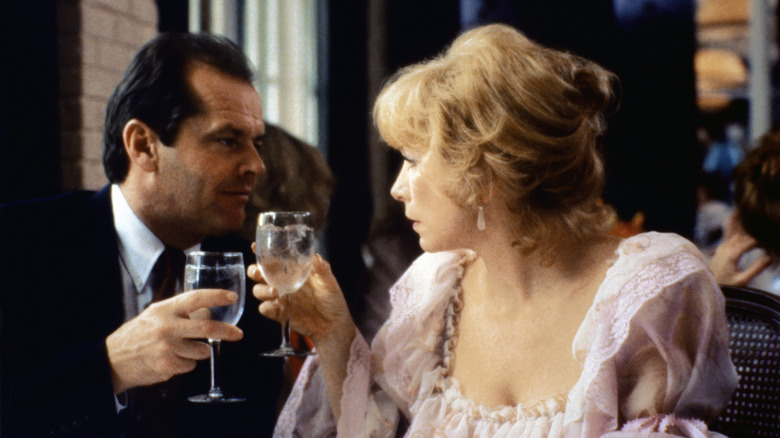 Aurora Greenway and Garrett Breedlove clink glasses in 'Terms of Endearment' (1983)