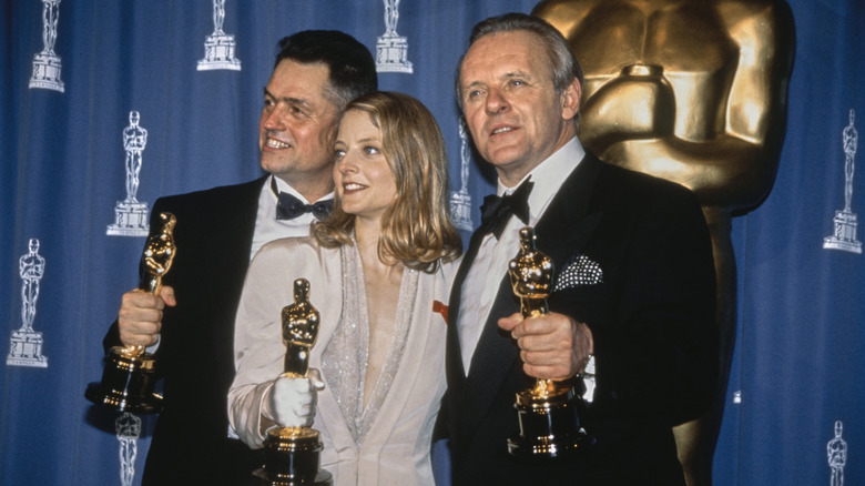 Jonathan Demme, Jodie Foster, and Anthony Hopkins hold their Oscars for 'The Silence of the Lambs' (1991)