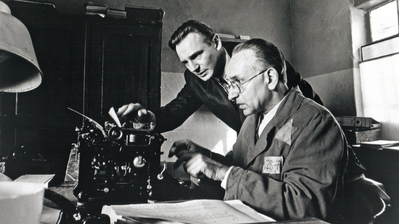Oskar Schindler and Itzhak Stern type a list in 'Schindler's List' (1993)