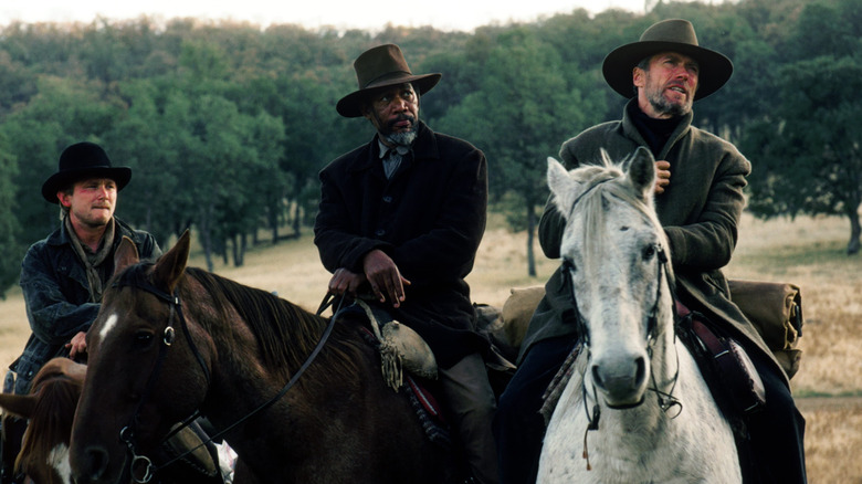 William Munny, Ned Logan, and The Scofield Kid ride horses in 'Unforgiven' (1992)