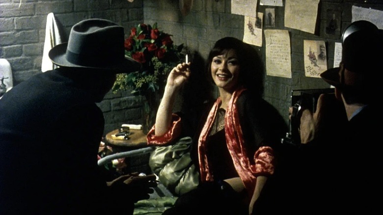 Velma Kelly absorbing the press attention in "Chicago" (2002)