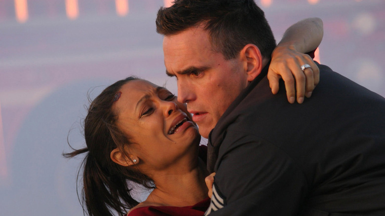 Christine in the arms of Sergeant John Ryan in "Crash" (2004)