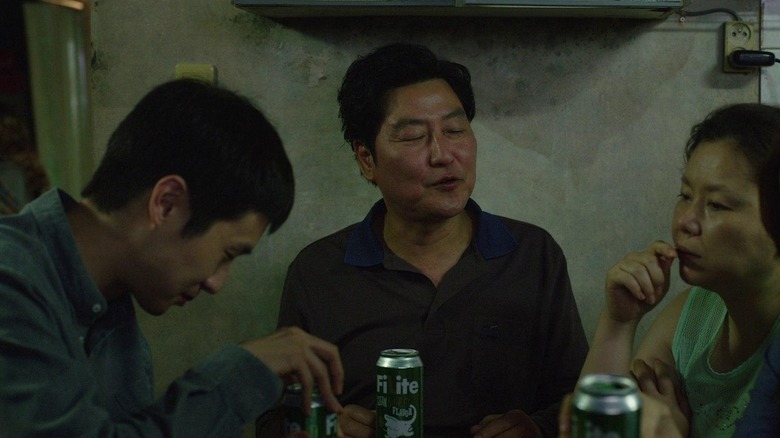 The Kim family sitting down to a meal in Parasite (2019)