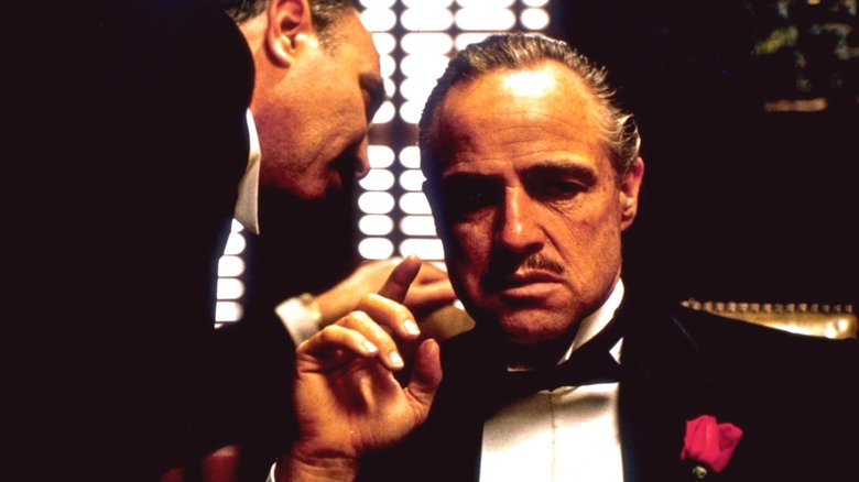 Don Vito Corleone receiving advice in "The Godfather"