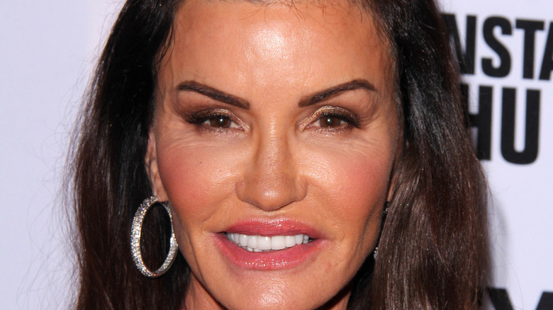 Janice Dickinson wearing hoop earrings