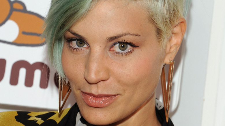 Lisa D'Amato wearing triangular earrings