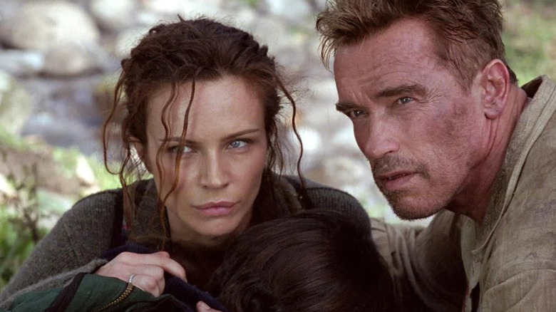 Arnold helps woman and child