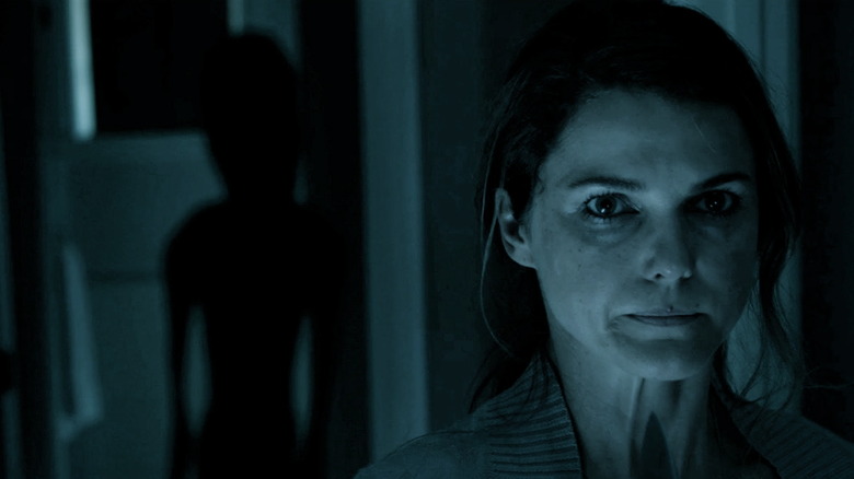 Keri Russell followed by an alien