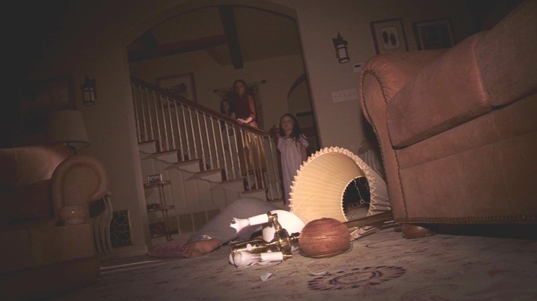 A family and a destroyed living room