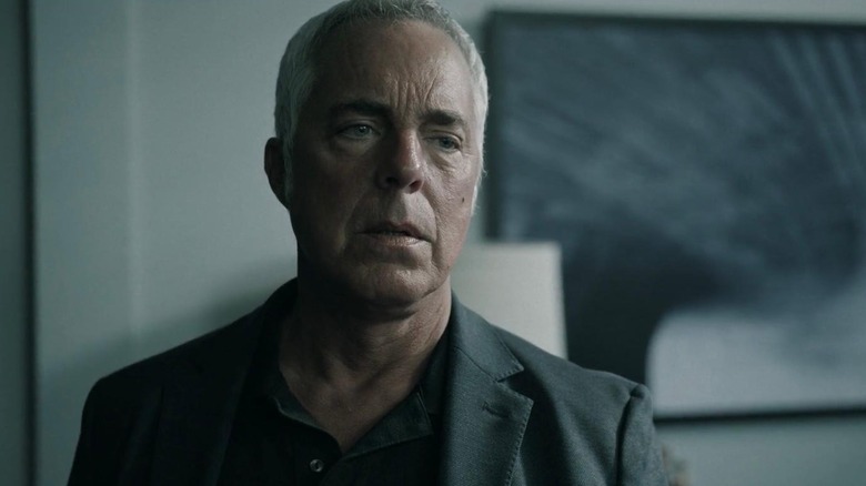 A tired-looking Bosch stands wearily in an apartment in 