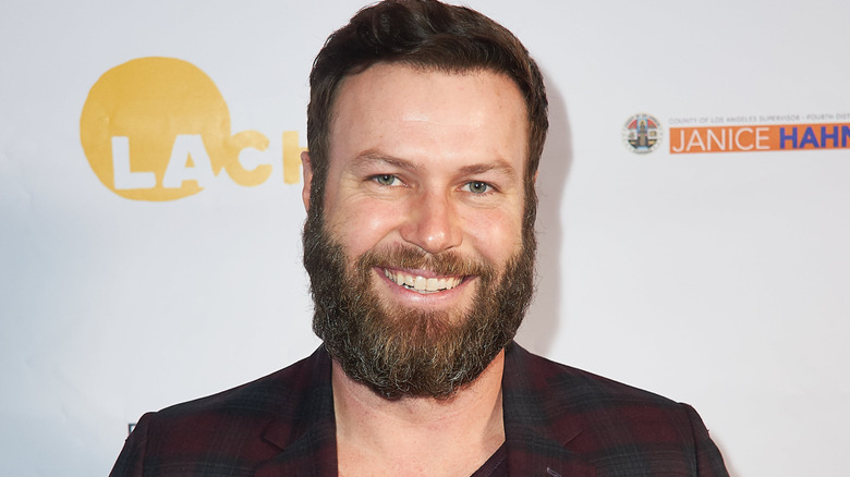 Taran Killam smiles