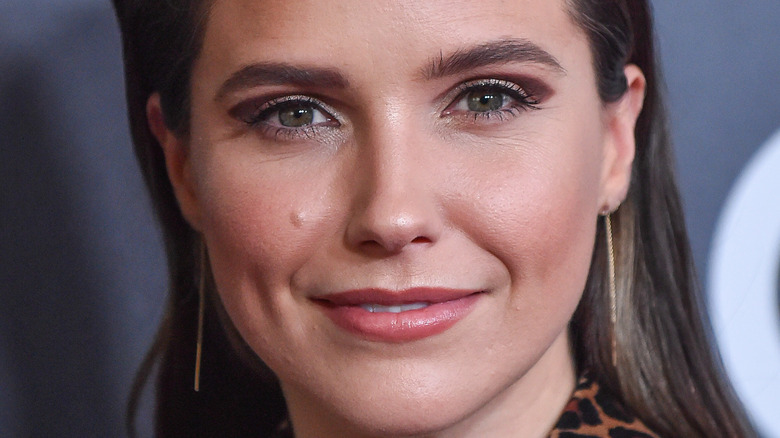 Sophia Bush smiles at camera