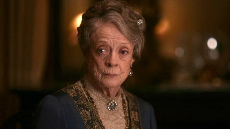 Violet in a warmly-lit room in "Downton Abbey" (2019)