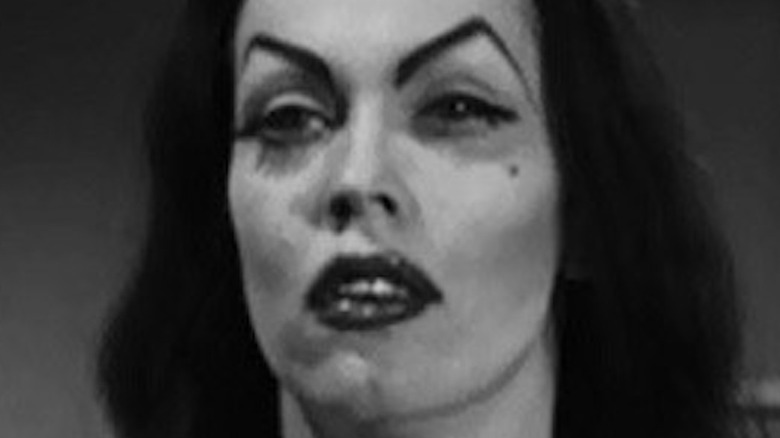 Vampira looks left