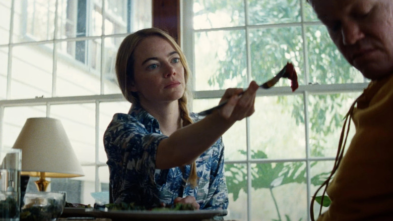 Liz offering her husband food in Kinds of Kindness
