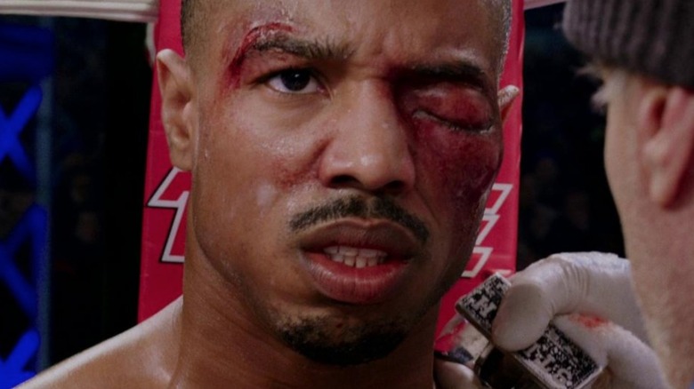 Creed bloodied with a bruised eye