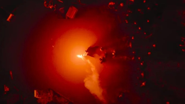Batman carrying a flare