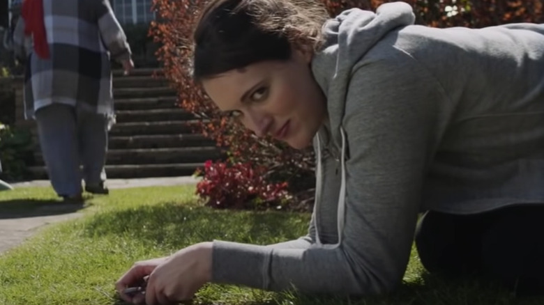 Fleabag performs manual labor at the retreat