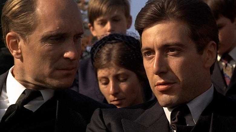 Robert Duvall and Al Pacino attend a funeral