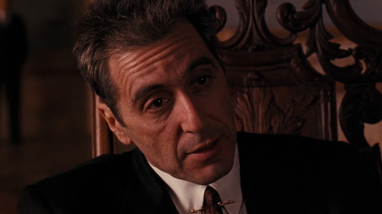 Al Pacino in a fancy suit in a chair