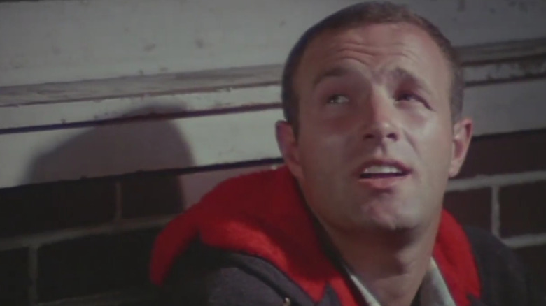 James Caan in a red and grey coat