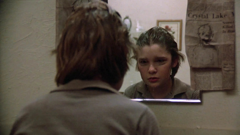 Young Tommy Jarvis looks in mirror in Friday the 13th: The Final Chapter (1984)