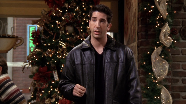 Ross talks beside Christmas tree