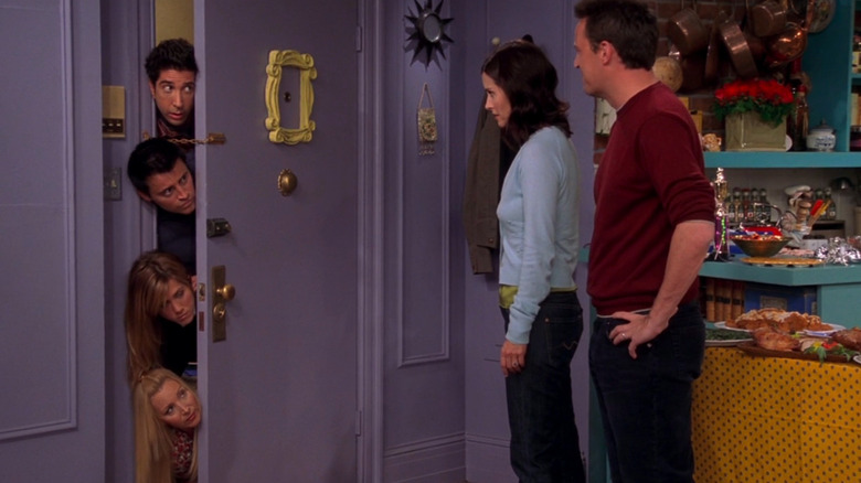 Four Friends look through door