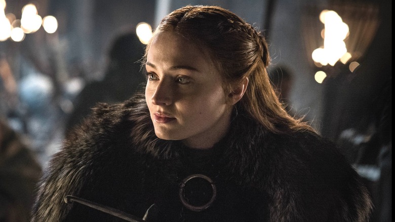 Sansa Stark smiling and looking to the left in "Game of Thrones."