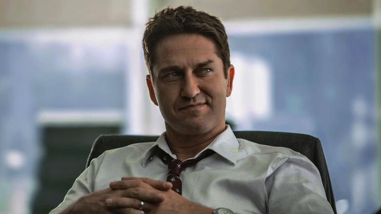 Gerard Butler folds hands