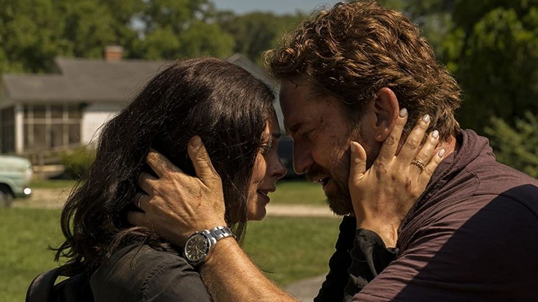 Morena Baccarin and Gerard Butler embrace