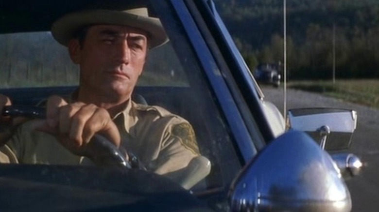 Tawes behind the wheel of his patrol car