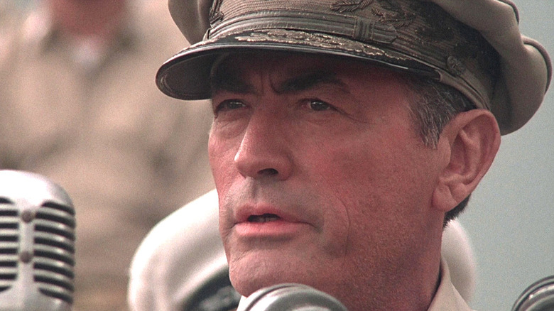 MacArtur speaks into a microphone