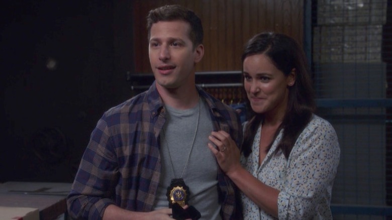 Jake Peralta and Amy Santiago smile