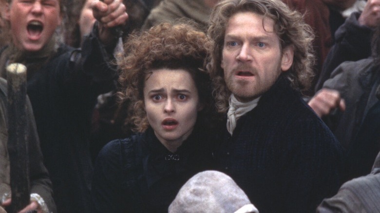 Victor Frankenstein and Elizabeth in the middle of an angry mob
