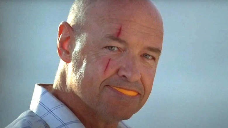 Locke smiling with an orange peel in Lost