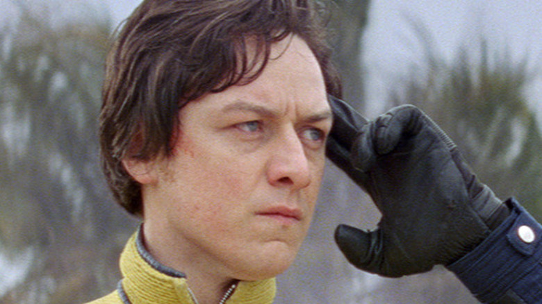 James McAvoy touching his forehead