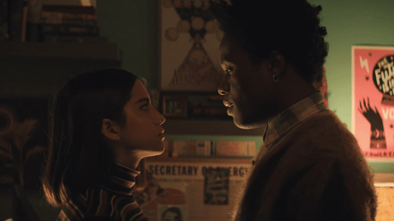 Julie and Stuart looking at each other in "Let It Snow" (2019)