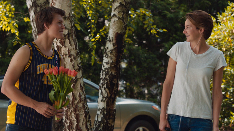 Gus holding flowers for Grace in "The Fault in Our Stars" (2014)