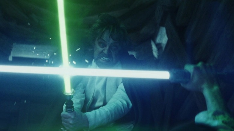 Luke fighting Kylo with lightsabers