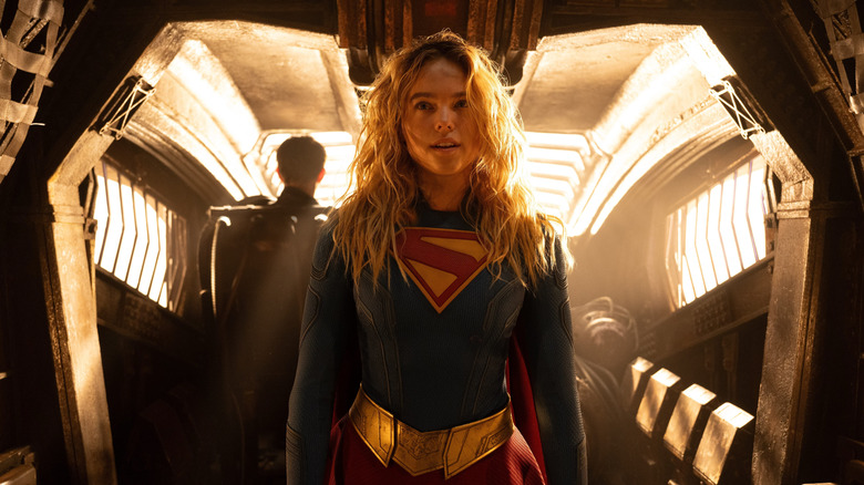 Supergirl standing while wearing her costume in 