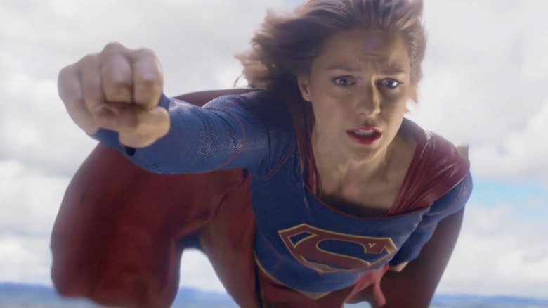 Supergirl flying with her fist forward in the television series "Supergirl"