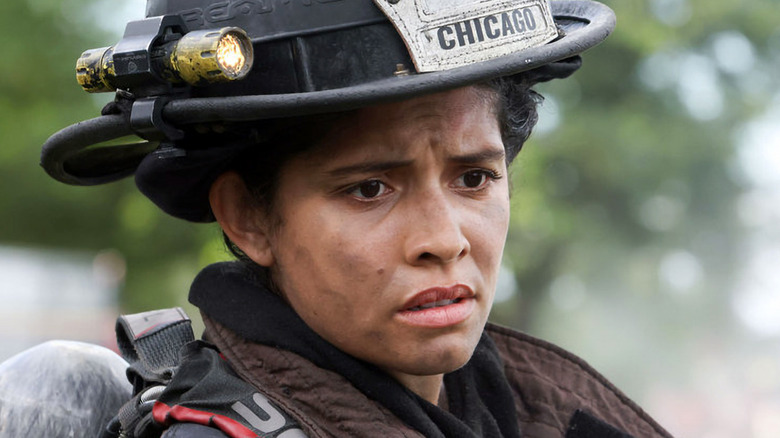 Stella Kidd wearing firefighting helmet